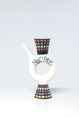 a white vase with a black and red design on it