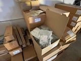a pile of boxes and boxes on the floor in a room