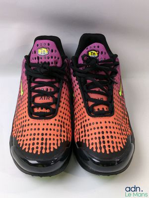 a pair of nike air max running shoes on a white surface
