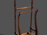 a wooden shelf with a coat rack on top of it