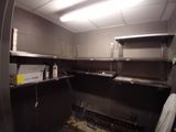 an image of a kitchen with a lot of shelves