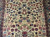 an oriental rug with a floral design on it