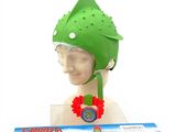 a close up of a green hat on a mannequin head