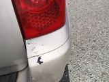 a close up of a car ' s tail light on the street