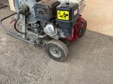 a small machine that is sitting on the side of the road