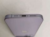 the back of a silver iphone with a small hole in the middle of it