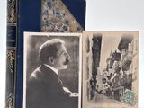 an old photo of a man in a suit and tie next to a book
