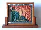 a picture of a plaque with a flag on it