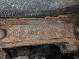 a close up of a rusted metal object on the ground