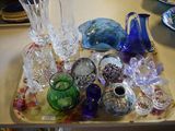 a tray that has many different glass items on it