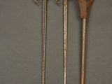 three different types of weapons are displayed on a gray surface
