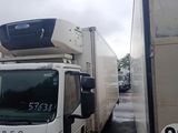 a white truck with a camera on top of it