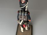 figurine of a soldier with a red hat and a blue uniform