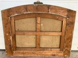 an old wooden window with a glass pane in the middle of it