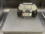 a video game controller sitting on top of a metal box