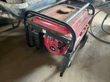 a red and black portable generator in a garage
