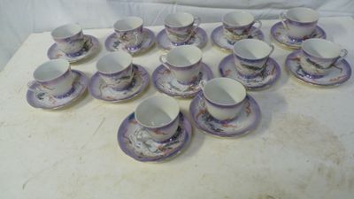 a lot of cups and saucers on a table