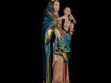 the statue of the virgin mary holding a child is shown against a black background