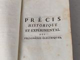 an open book on a table with a black and white title