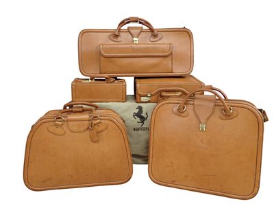 several pieces of luggage sitting on top of each other on a white surface