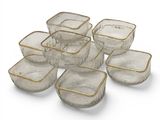 six bols en verre transparent bordés d'or, disposés sur un plan de travail blanc