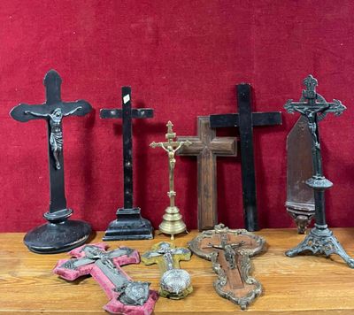 many different types of crosses on a table