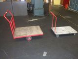 two hand trucks that are sitting on the floor