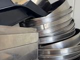 a stack of pans sitting on top of a stove