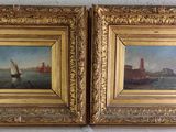 pair of oil paintings of boats in a golden frame on a white wall