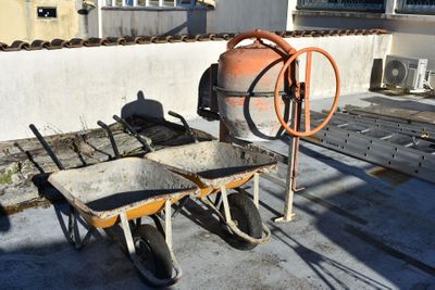 a wheelbarrow and a wheelbarrow on the roof of a building