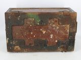 an old suitcase that is sitting on a white surface