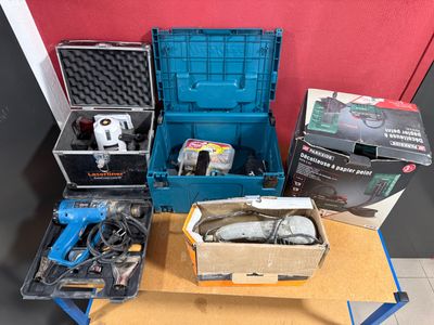 a box of tools sitting on a table next to a box of tools