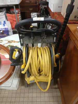 a hose that is attached to a cart in a room