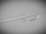 a clear glass spoon with a handle on a white surface