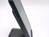 a cell phone that is sitting on top of a stand