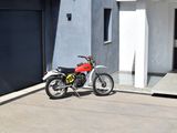 a motorcycle parked in front of a building with a garage