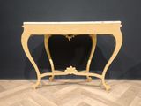 a small table with a marble top on a wooden floor