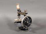 a small sewing machine that is sitting on a table