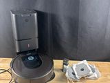 an image of a robot vacuum sitting on top of a wooden table