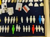 a shadow box with a bunch of small figurines in it