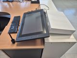 a tablet computer sitting on top of a desk next to a keyboard and mouse