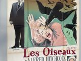 poster of a man in a suit standing next to a woman with a bird on her shoulder