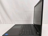 the back of a laptop computer sitting on top of a white surface