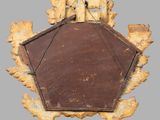 an old mirror with a wooden frame on the wall