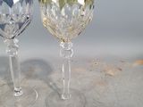 two wine glasses sitting next to each other on a table
