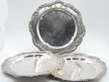 two silver plate with a silver rim and a silver plate with a silver rim and a silver plate with a silver rim and a silver plate with a silver rim