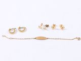 three pairs of earrings and a bracelet on a white background