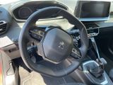 the interior of a car with a steering wheel and dashboard controls