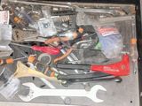 a suitcase full of tools that are sitting on the floor
