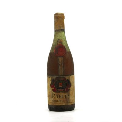 a bottle of wine that is sitting on a table
